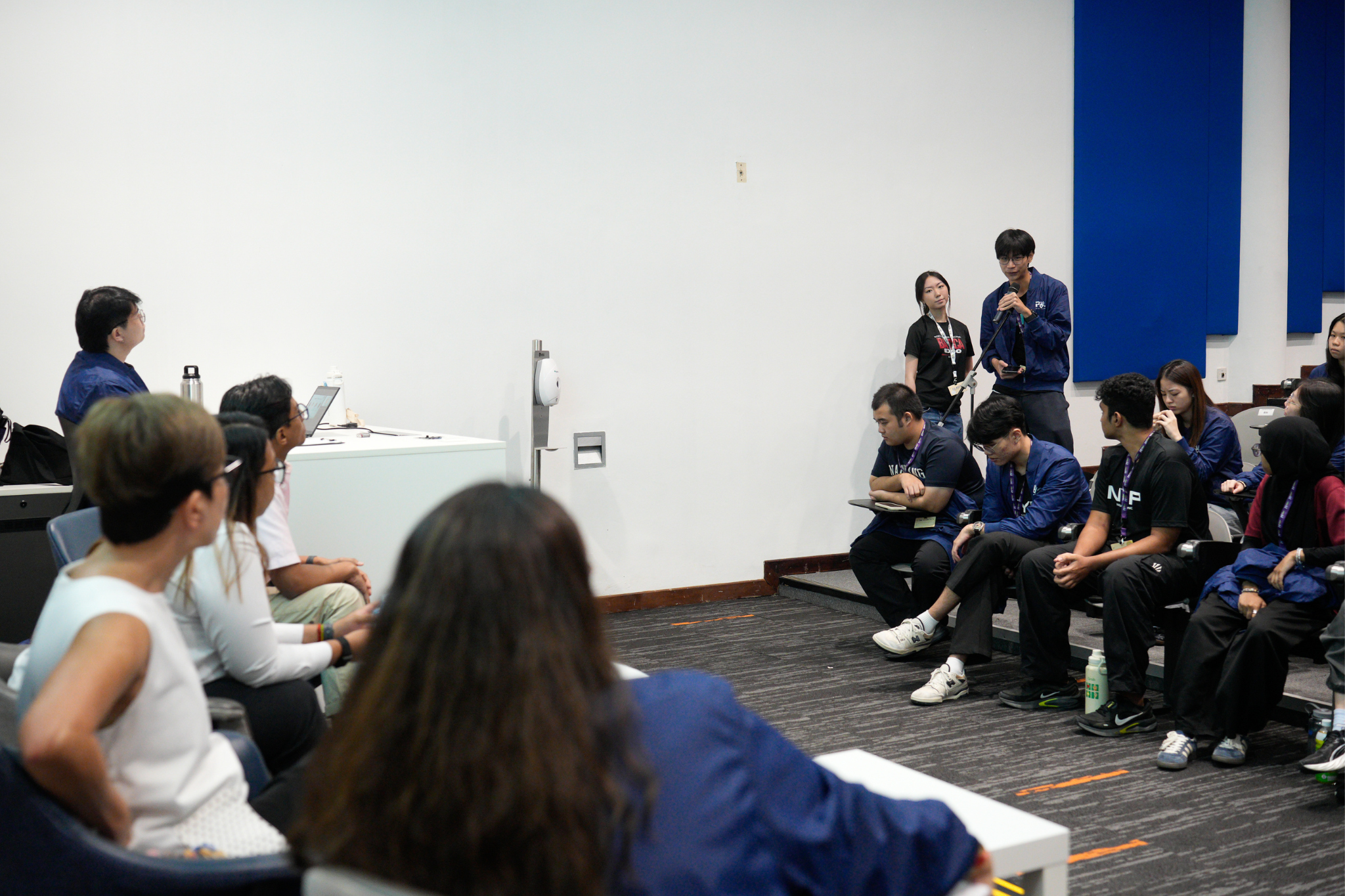Student delegates participate in a panel dialogue exploring different definitions of success and achievement.